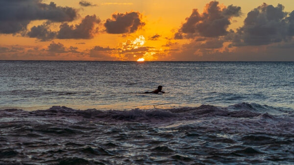 Sunset And Surfers At Sunset Beach